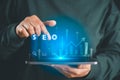 Hand using tablet with glowing SEO interface and rising analytics chart, symbolizing search engine optimization, keyword strategy Royalty Free Stock Photo