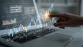 Hand Using Touchscreen Laptop to Analyze Growth Data with Modern Graphs and Charts Representing Business Statistics and Royalty Free Stock Photo