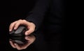 Hand using mouse on dark background Royalty Free Stock Photo