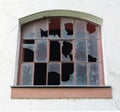 Broken window with a brown frame Royalty Free Stock Photo