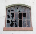 Broken window with a brown frame Royalty Free Stock Photo