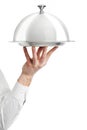 Hand of waiter with cloche lid Royalty Free Stock Photo