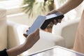 Hand of waitress holding contactless payment terminal Royalty Free Stock Photo