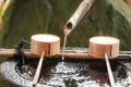 The Hand Wash Sink with bamboo ladle for cleaning in a Japanese Temple Royalty Free Stock Photo