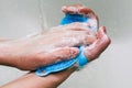 Hand washing with soap. White foam with bubbles on hands. The procedure for cleaning hands from dirt, germs and bacteria. Royalty Free Stock Photo