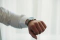 Hand with watch. groom in wedding morning