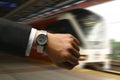 Hand with watch with LRT background Royalty Free Stock Photo