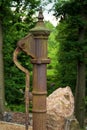 Hand water pump Retro style. Manual vintage construction in green park Royalty Free Stock Photo