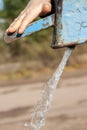 Hand water pump - retro style pumping the water Royalty Free Stock Photo