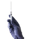 A hand wearing a blue glove holding a syringe isolated on a white background Royalty Free Stock Photo