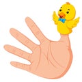 Hand wearing a duck finger puppet on thumb Royalty Free Stock Photo