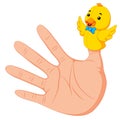 Hand wearing a duck finger puppet on thumb