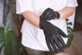 The hand wearing a rubber glove. Symbolizing safety in work. It conveys approval Royalty Free Stock Photo