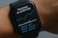 Hand Wearing Smartwatch Displaying Trading Algorithm with Buy Signal and Price Chart Data Royalty Free Stock Photo