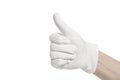 Hand wearing white glove showing Thumbs up signal