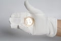 Hand wearing White Gloves holds Bitcoin Crypto Currency.Mining concept. Royalty Free Stock Photo