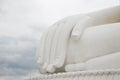 The hand of the white Buddha sky blue background. Royalty Free Stock Photo
