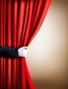 Hand in a white glove pulling curtain away. Theater. Royalty Free Stock Photo