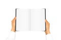 Hand in white shirt sleeve holding blank book Royalty Free Stock Photo