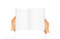 Hand white shirt sleeve holding book Royalty Free Stock Photo