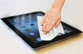 Hand with white wet wipe tablet cleaning Royalty Free Stock Photo