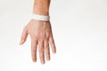 Hand with white wristband mockup. Empty ticket wrist band design