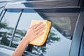 Hand wipe cleaning the car glass