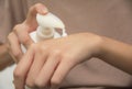 Hand of woman apply lotion on skin of hand. Royalty Free Stock Photo