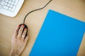 Hand of a woman on a black mouse Royalty Free Stock Photo