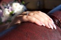 Hand of woman close up. Hand of bride with nice ring. Hand of the bride isolated in blurry background. Bride going to the ceremony