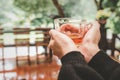 Hand woman and cup tea in nature background Royalty Free Stock Photo