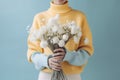 hand woman floral flower blue romantic bouquet yellow sweater white beauty. Generative AI. Royalty Free Stock Photo