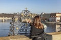 Hand of woman in frame, person rubbing the bronze plaque on Charles bridge, making a wish Royalty Free Stock Photo