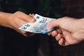 Hand of woman is giving euro money to a young man Royalty Free Stock Photo