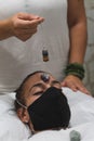 Hand of a woman healer applying reiki and energy therapies through the use of a pendulum Royalty Free Stock Photo