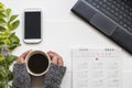 Hand of woman holding coffee with equipment office for business work Royalty Free Stock Photo