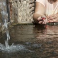 Woman makes a wish at the fountain Royalty Free Stock Photo