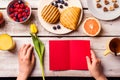 Hand of woman holding empty greeting card. Breakfast meal. Royalty Free Stock Photo