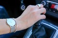 Hand of woman holding gear shifter, manual transmission driving Royalty Free Stock Photo