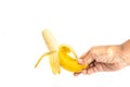 Hand woman holding a half peeled ripe banana Royalty Free Stock Photo