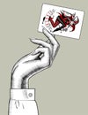 Hand of woman holding Joker playing card Royalty Free Stock Photo