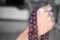 Hand woman holding rosary on blur backgrond. Royalty Free Stock Photo