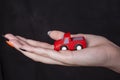 Hand Of Woman Holding Toy Car Royalty Free Stock Photo