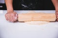 Hand of woman making dough pastry pie with rolling wooden Royalty Free Stock Photo