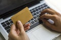 Hand of a woman making purchases through the Internet, keyboard and the card Royalty Free Stock Photo