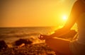 Hand of woman meditating in a yoga on beach Royalty Free Stock Photo