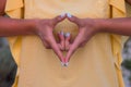 Hand of a woman meditating in a yoga pose on the beach at sunset Royalty Free Stock Photo