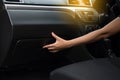 Hand woman open glove compartment box inside new modern car Royalty Free Stock Photo