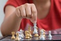 Hand of woman playing chess for business tactic and planning met