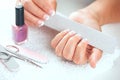 Woman polishing her nails Royalty Free Stock Photo